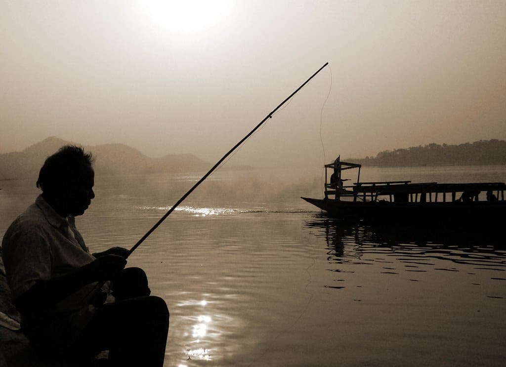 An angler fishing from a boat
