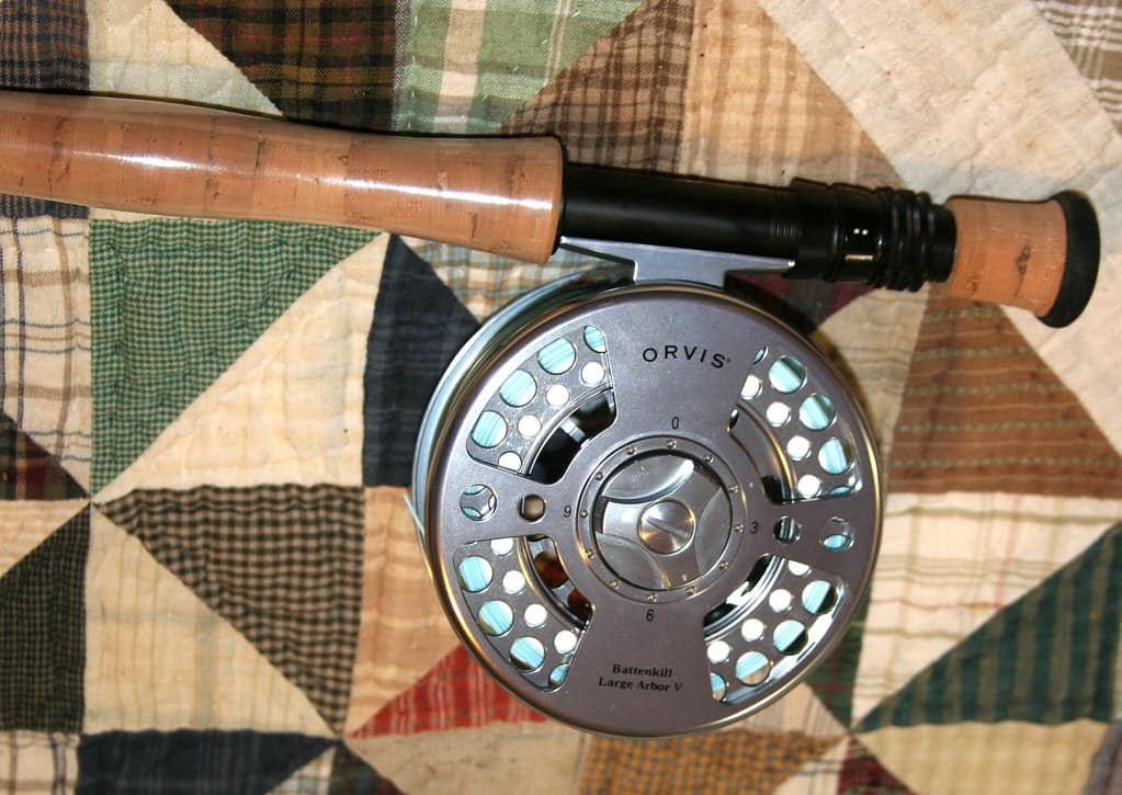 A rod and reel laid out together