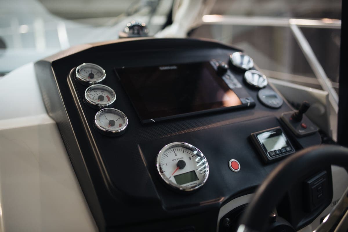 A modern boat dashboard with displays and gauges